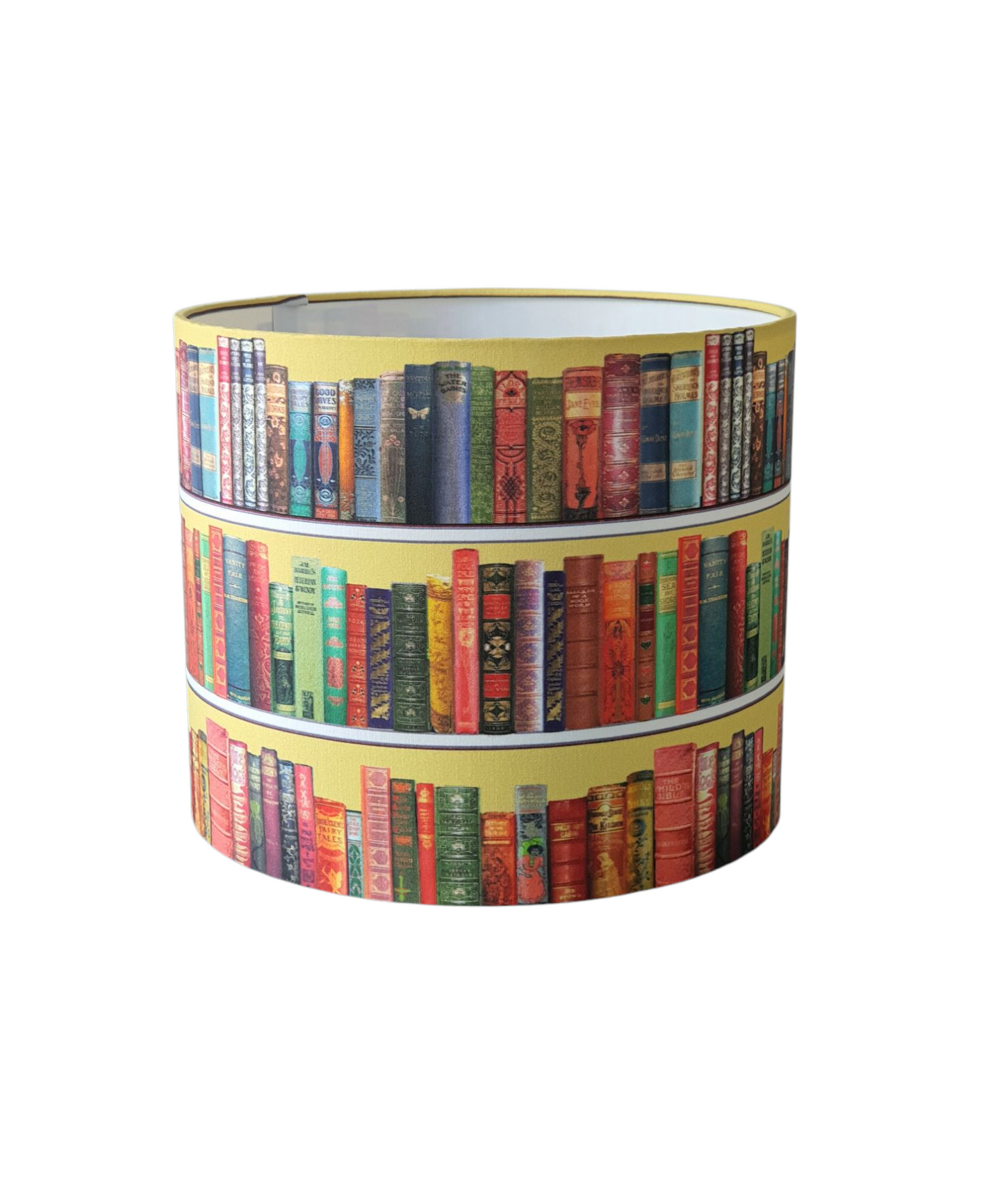 Handmade 25cm drum lampshade made with colourful books pattern on a yellow background.