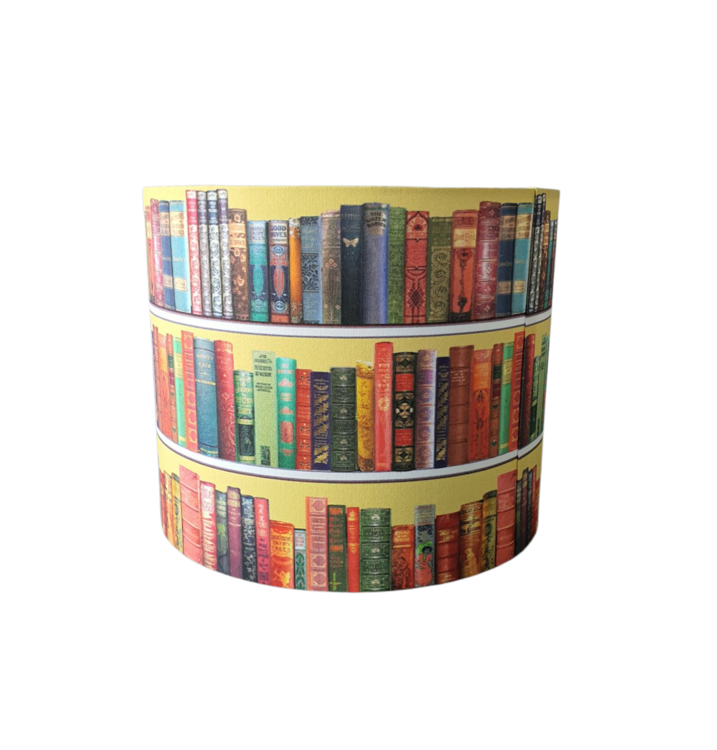 Another view of the books on a bookshelf patterned handmade lampshade and the photo shows the side on join of the fabric at the seam.