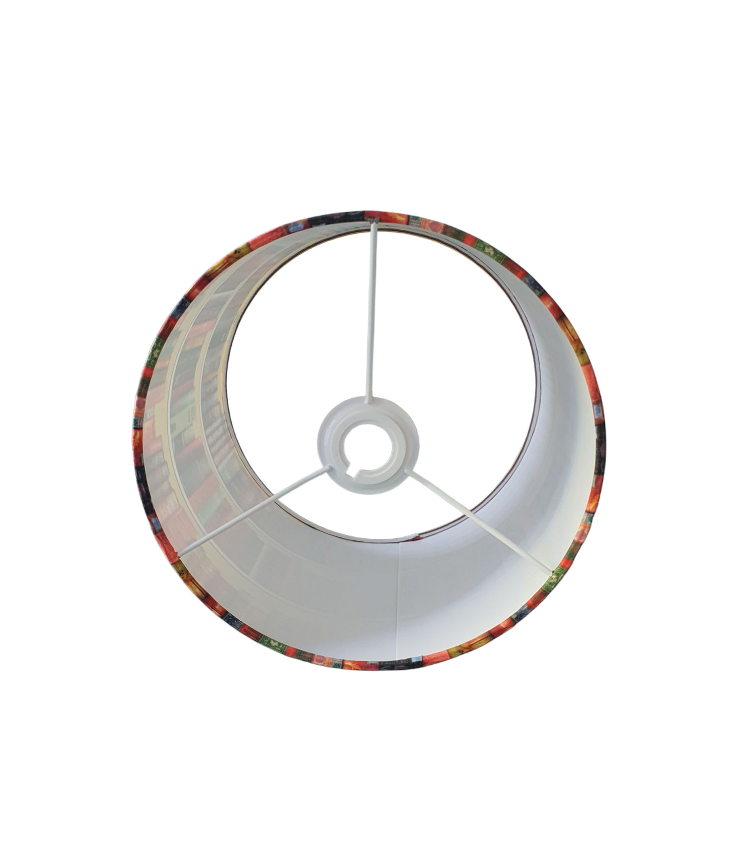 A photo from the bottom of the lampshade through the spokes of the lampshade.