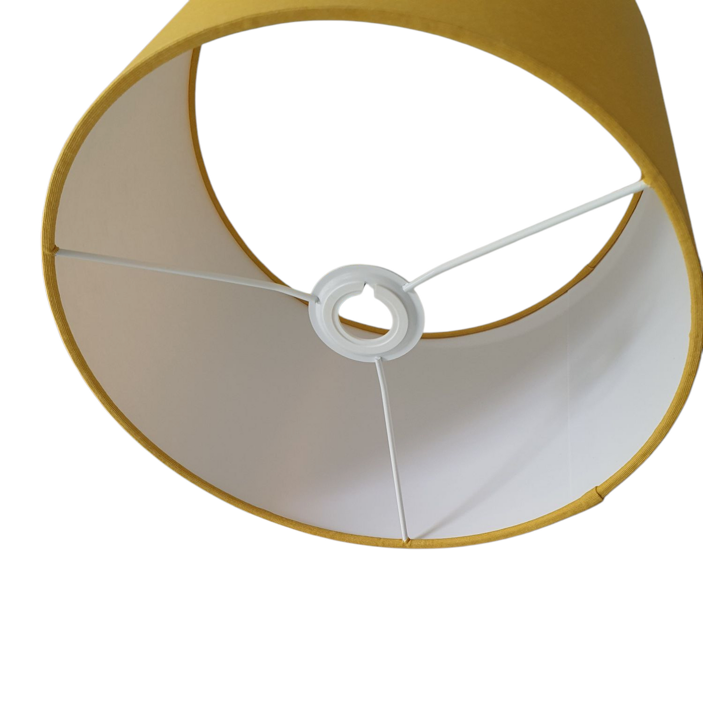 A photo of the drum shade through the spokes of the ring of the shade