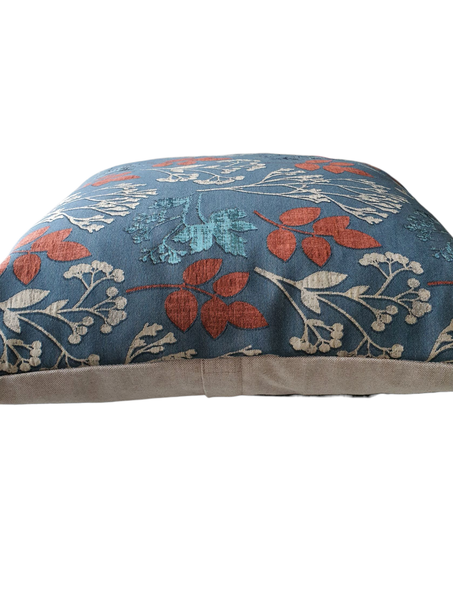 This photo shows the patterned front and the plain neutral fabric on the reverse. The enclosed zip is halfway down the reverse of the cushion cover, as indicated in the photo.