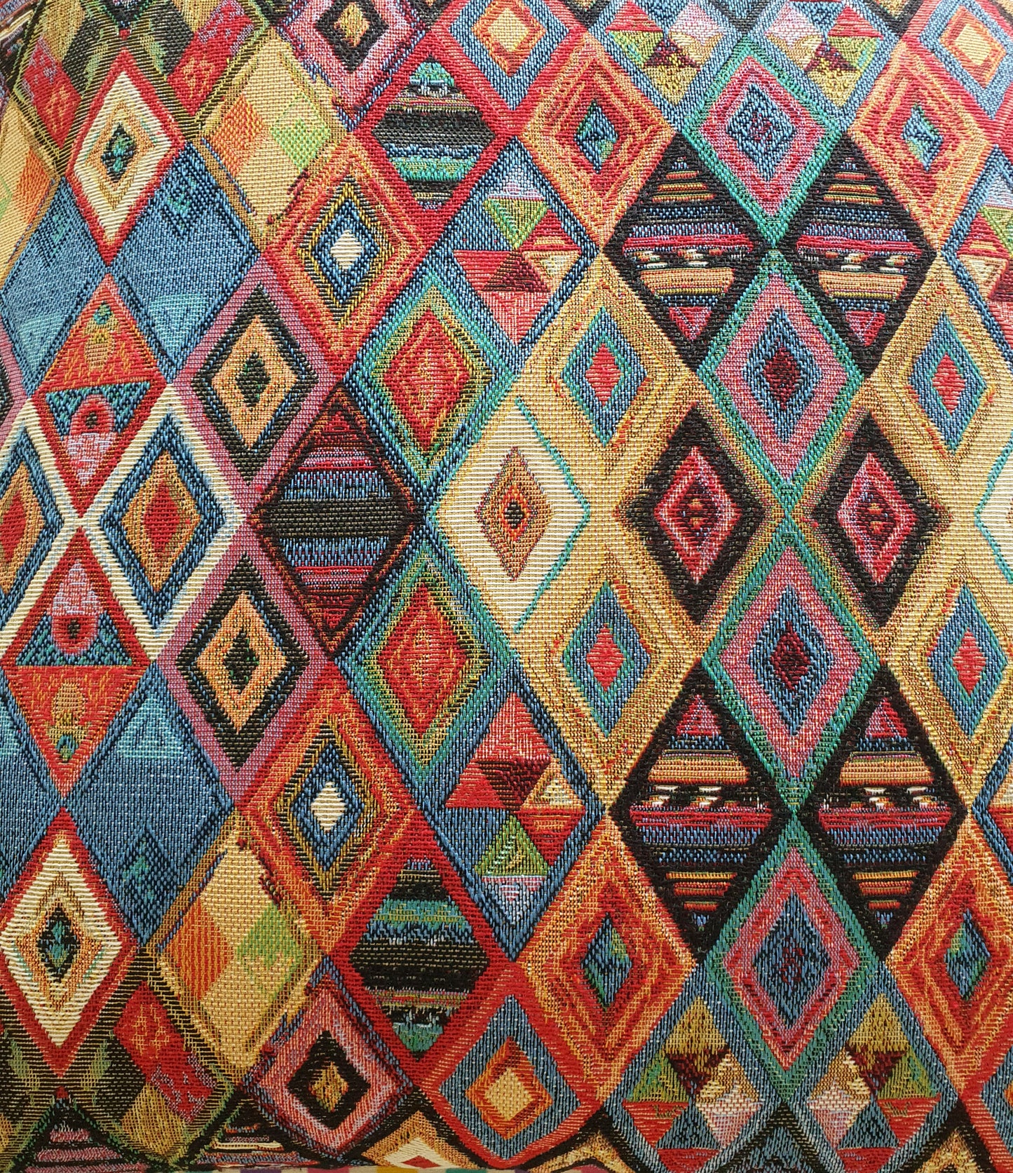 Another close up of the multicolour pattern of the tapestry fabric which has been used on the front of the cushion cover. This is a New World tapestry fabric which is of soft furnishing quality.