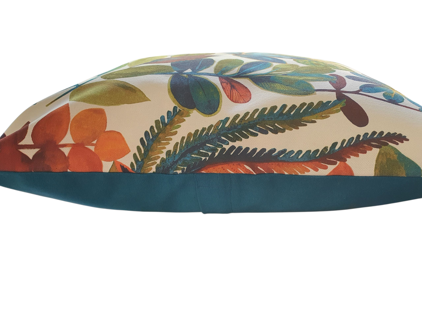 This photo shows the patterned front with the complementing teal fabric on the reverse and the enclosed zip around half way on the cushion cover. Please note the cushion insert is not included.