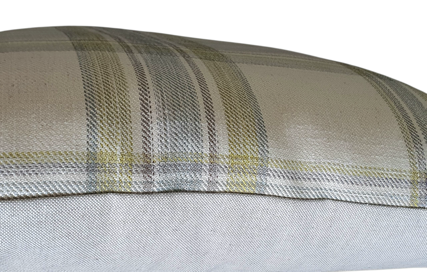 A side photo which shows part of the pattern on the front of the cushion cover and the neutral fabric on the reverse of the cushion cover.
