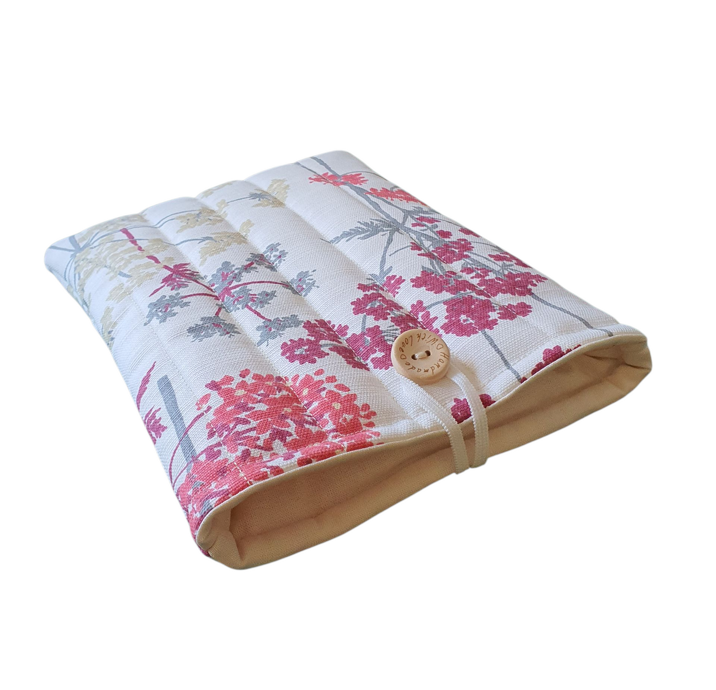 The handmade Book Pouch is padded with wadding, which has been quilted, lined with neutral fabric and has elastic and button fastening.