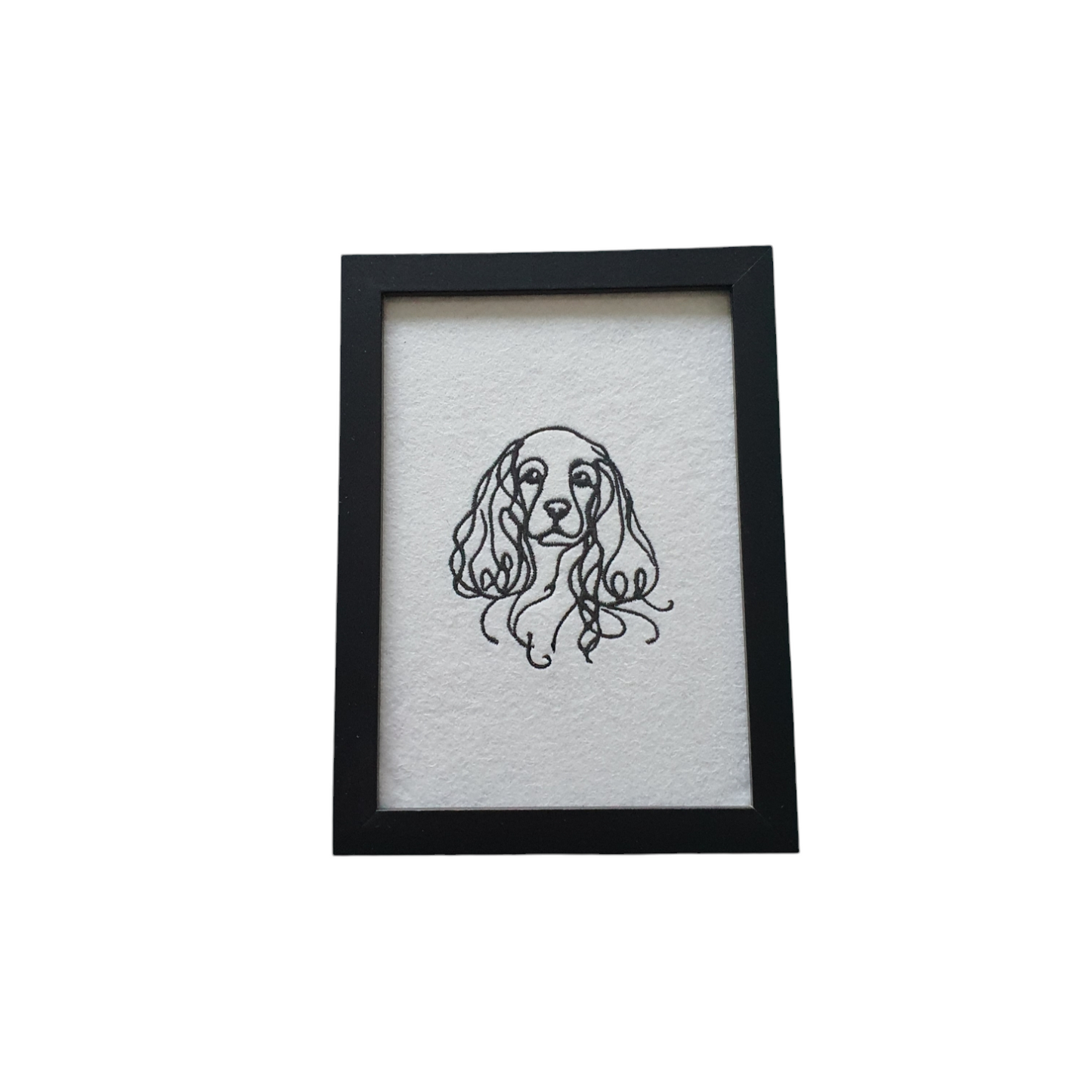 This Dog Lovers Gift is a machine embroidered Cocker Spaniel in black silhouette outline in a black frame.