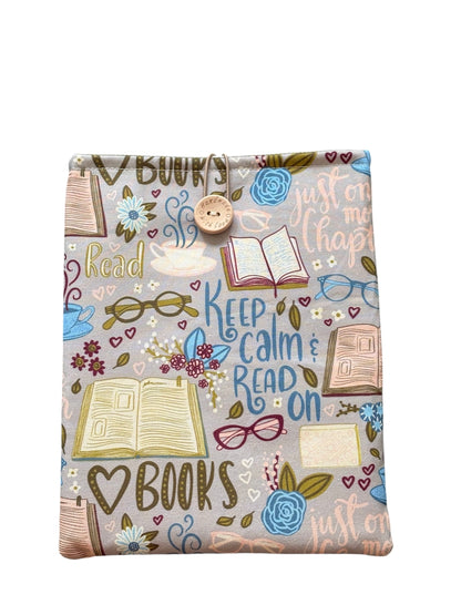 Handmade Padded Book Pouch made with book themed fabric, being an ideal Book Lovers Gift.  The Book Cover is approximately 24cms x 18.5cms and as well as offering protection for books may also be suitable for a Kindle e-Reader but please check the measurement of your device prior to placing an order.