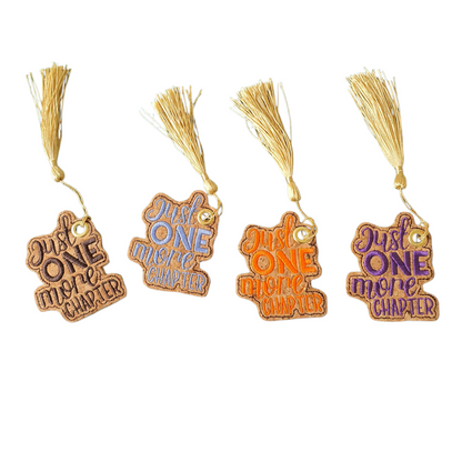 This photo is of all the embroidered Bookmarks in colours of dark brown, light blue, orange and purple with eyelets and gold coloured tassels.