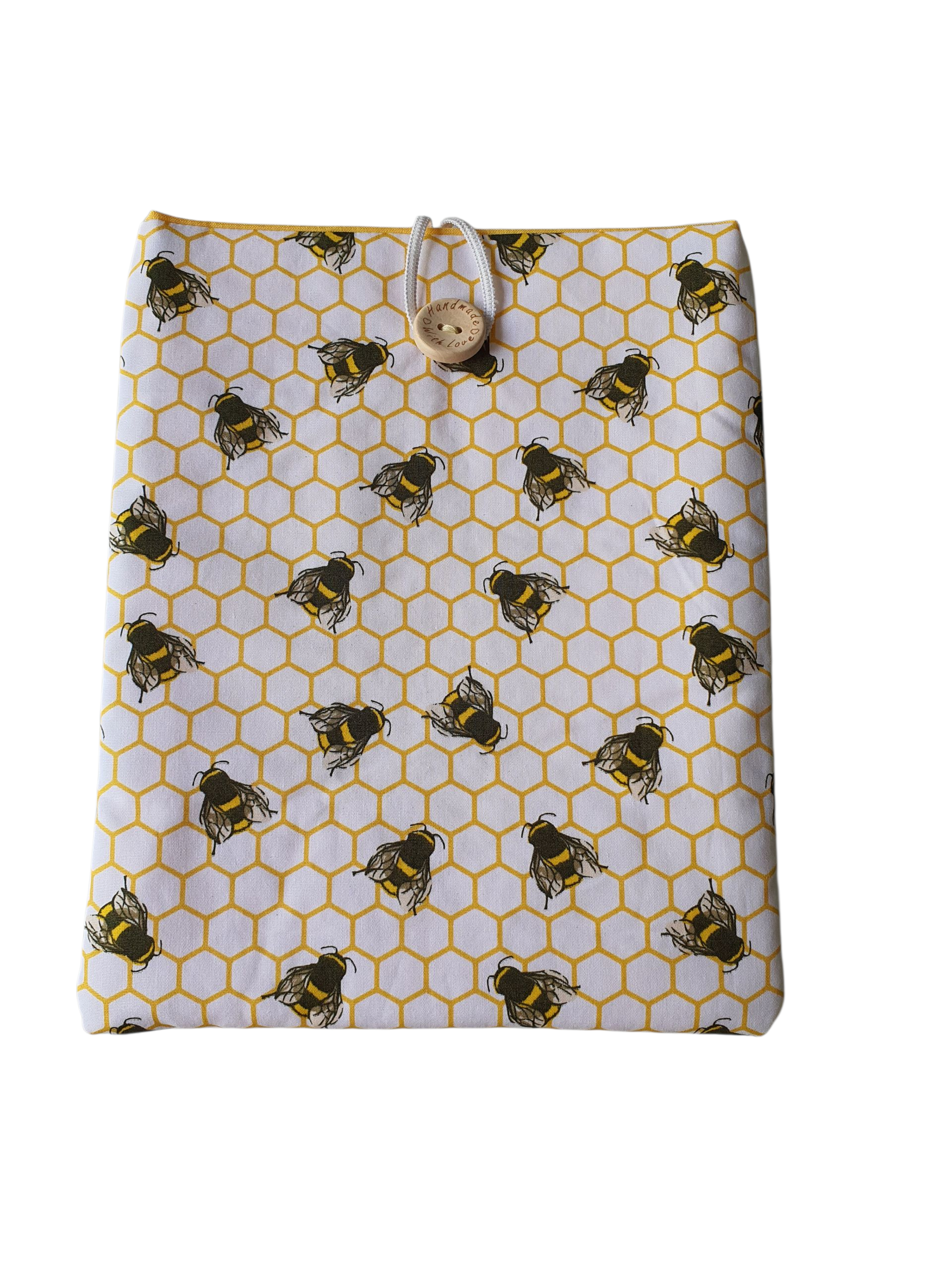Handmade Book Pouch made with honeycomb bees fabric.  The Book Sleeve is padded with fusible wadding, lined with yellow fabric and fastens with elastic and a button.  This would be an ideal Book Lovers Gift.