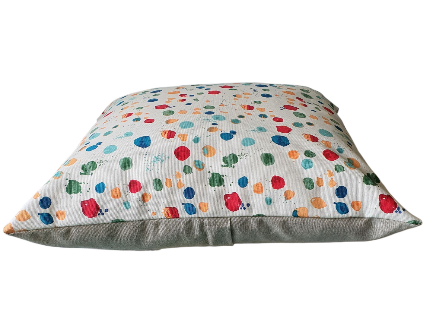 This photo shows the front of the cushion with its multicolour patterned front and the reverse of the cushion cover with the neutral coloured fabric.  The enclosed zip is also indicated which is approximately half way down the reverse of the cushion cover.