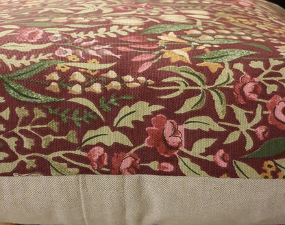 Sideways view showing the patterned fabric to the front and the neutral fabric on the reverse and the enclosed zip.