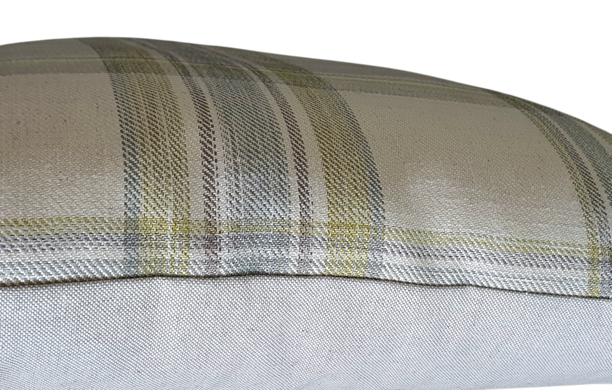 A side photo which shows part of the pattern on the front of the cushion cover and the neutral fabric on the reverse of the cushion cover.