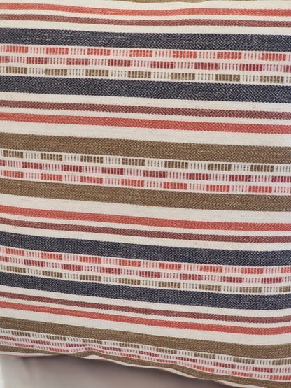 A close up of the multicolour striped fabric used to make the zipped cushion cover.
