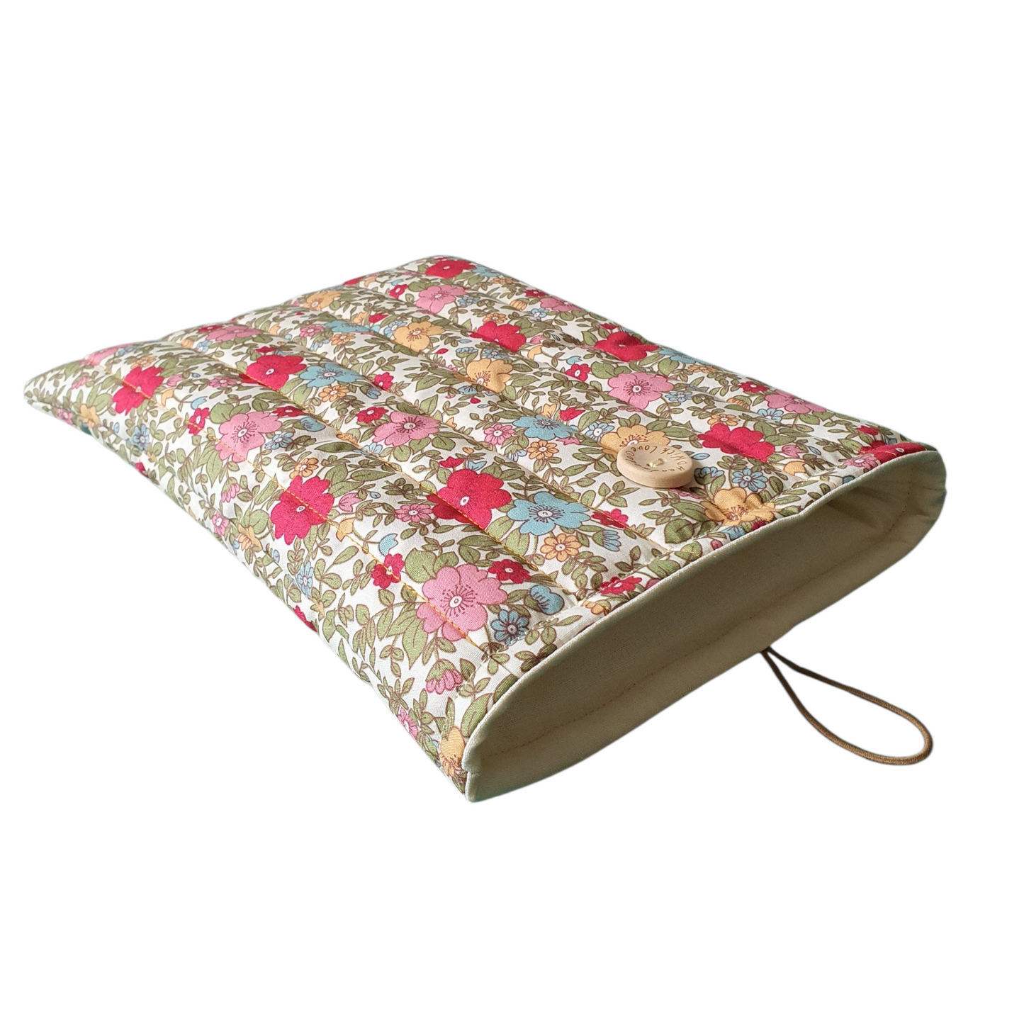 The floral Book Pouch is padded with wadding and lined with complementing neutral fabric.