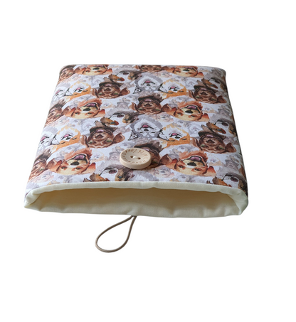 The Book Cover is lined with neutral fabric and has elastic and button closure.