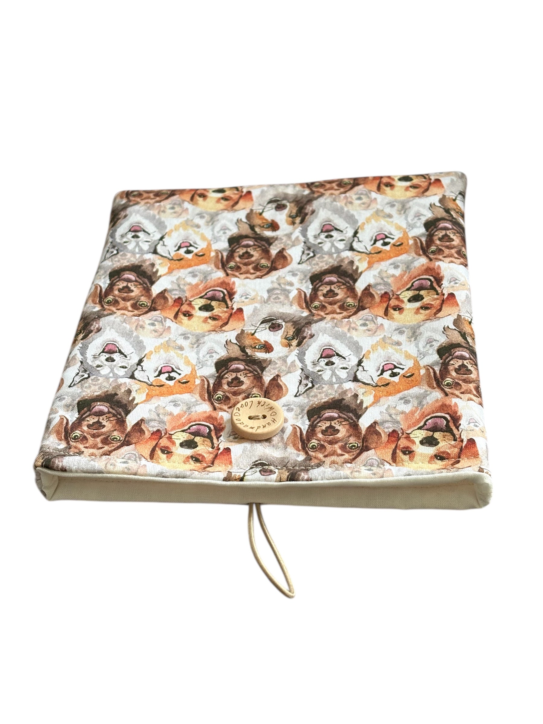 The dog patterned fabric padded Kindle/Book Pouch is approximately 18cms x 16cms (7 inches x 625 inches). Please check the measurements of your device or book prior to placing an order.