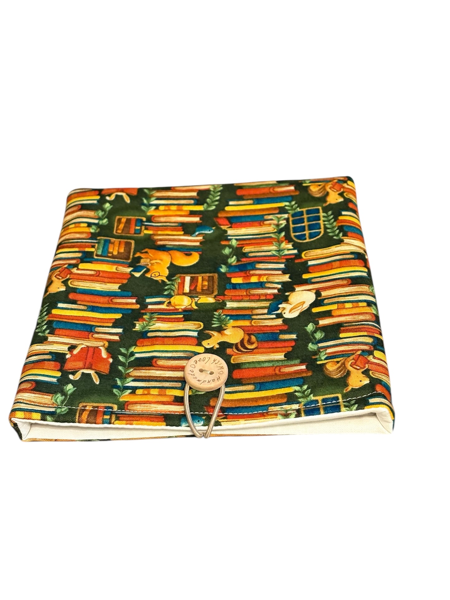 The handmade Pouch has elastic and button fastening.