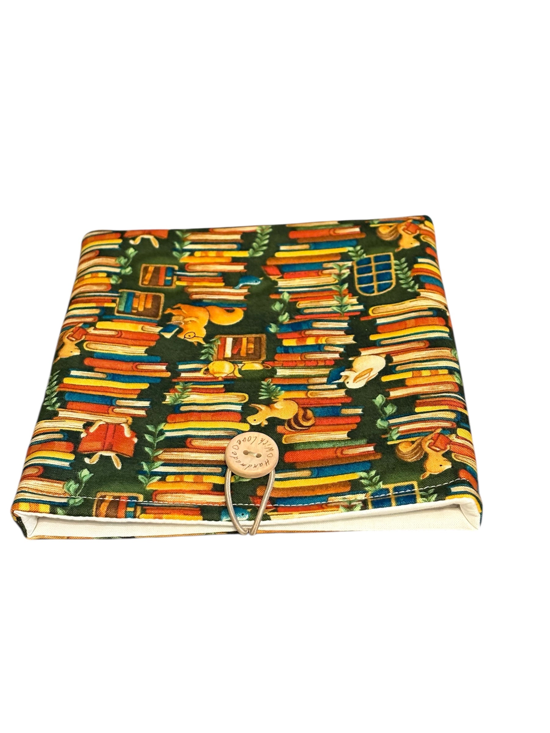 The handmade Pouch has elastic and button fastening.