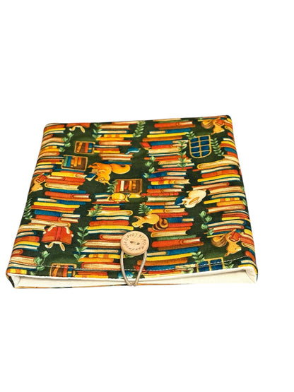 The handmade Pouch has elastic and button fastening.