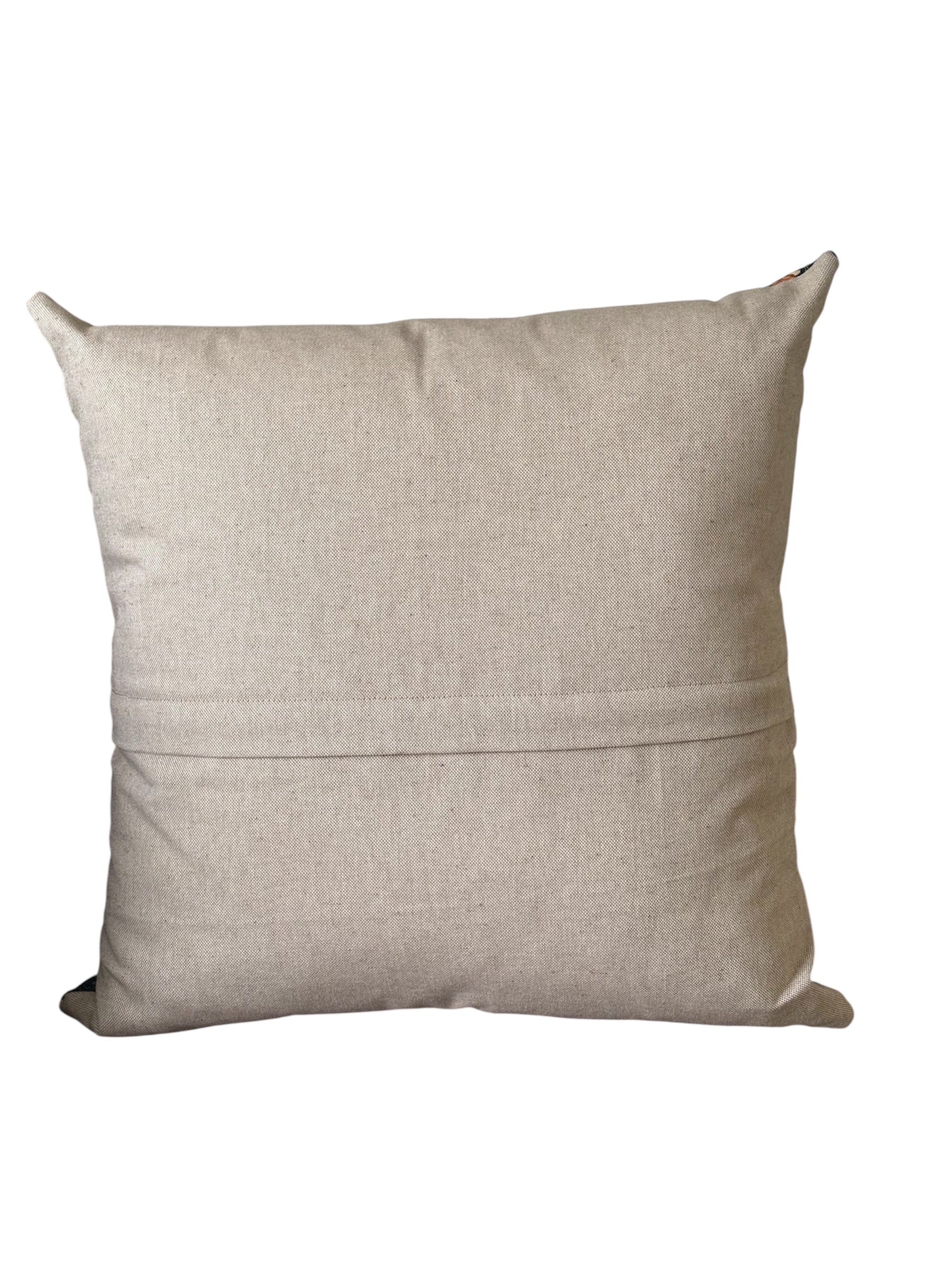 The reverse of the cushion cover and the enclosed zip is beneath the small flap shown in the photo.  The cushion cover is approximately 17.5 inches by 17.5 inches (44cms x 44cms).