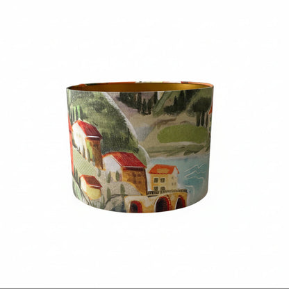 Handmade 30cm drum lampshade made with Italian Villa fabric and is lined with fire retardant brushed gold PVC.