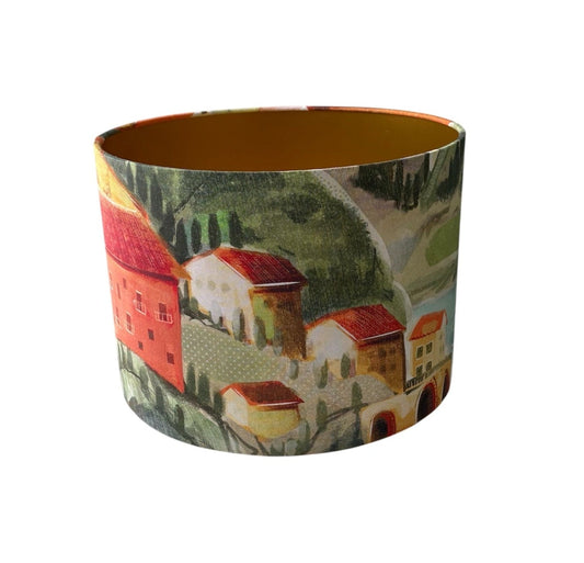 This is a colourful drum lampshade made with striking Italian Villa Sunset fabric.  The colours on the fabric are so vibrant and would certainly add colour to home decor.   