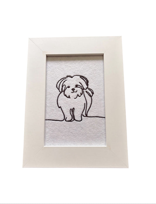 This is a framed sketch style Maltese dog pattern in black embroidery cotton and mounted in a white wooden frame.  The glass fronted display area is 4 inches by 6 inches (10cms x 15cms).  This framed cute little sketch style Maltese dog would make an ideal Dog Lovers Gift. 