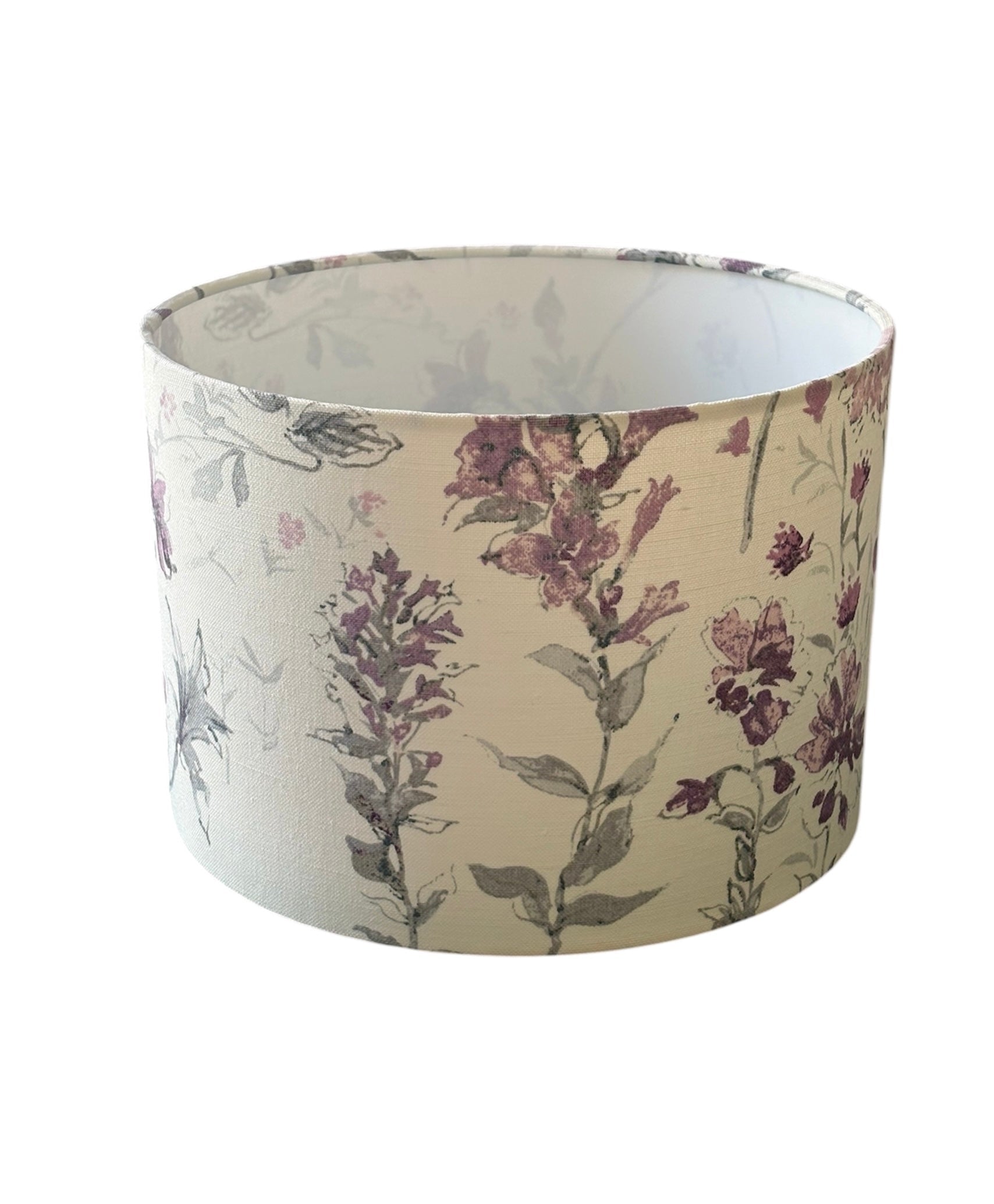 The handmade 30cm diameter drum lampshade is 21cms in height.  The shade is lined with fire retardant white PVC which meets UK standards and has passed the Lighting Association Glow Wire Test.