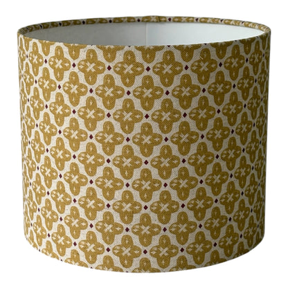 Handmade 25cm lampshade made with Prestigious Textiles Billy Honey fabric.  The geometric style pattern would suit any style of home decor, including modern or traditional.  