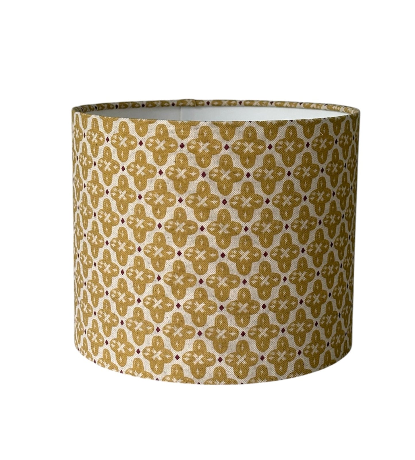 The handmade drum shade is 25cms diameter and 21cms high, is lined with white fire retardant PVC which meets UK Standards and has passed the Lighting Association Glow Wire Test. 