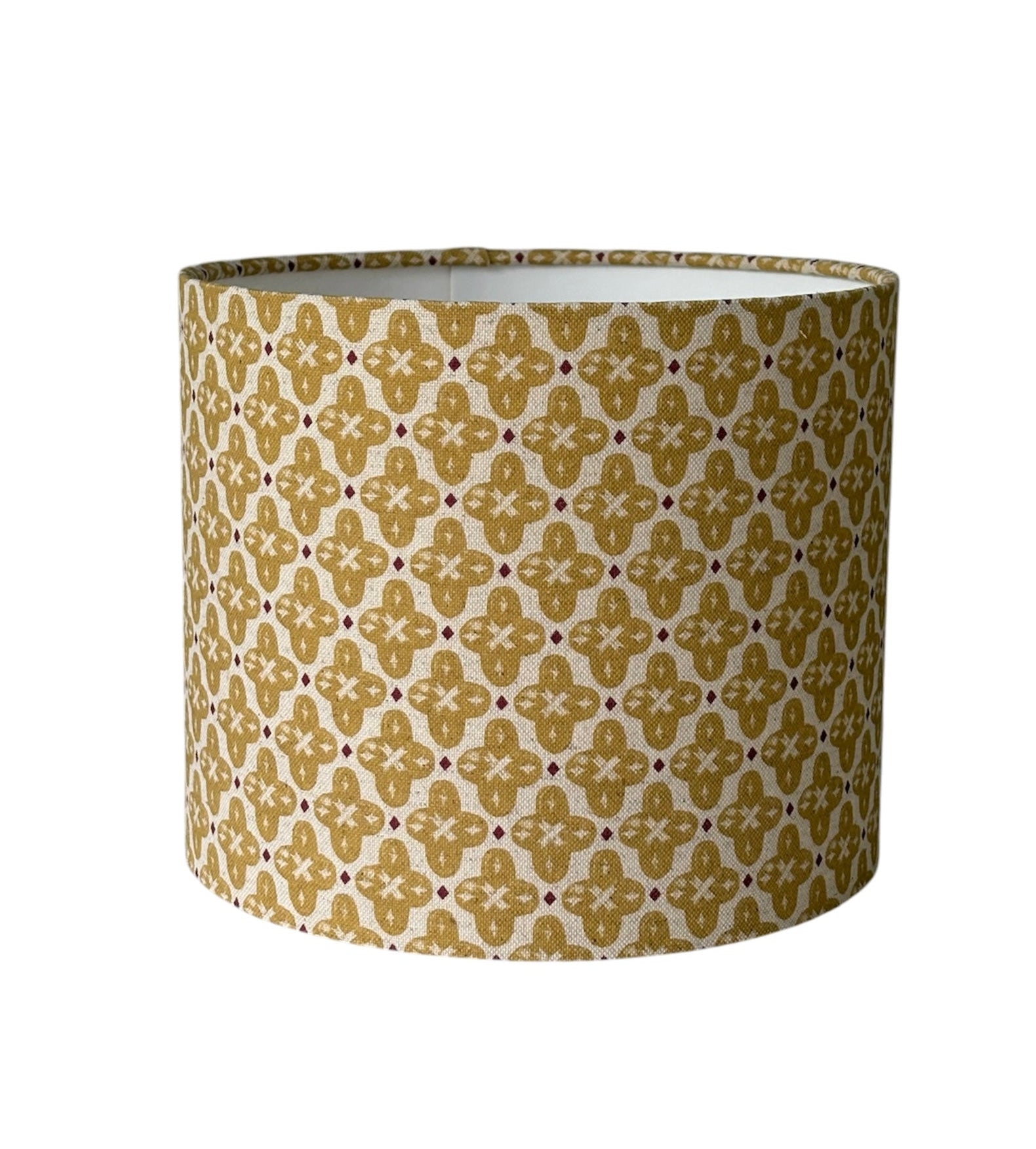 The handmade drum shade is 25cms diameter and 21cms high, is lined with white fire retardant PVC which meets UK Standards and has passed the Lighting Association Glow Wire Test. 