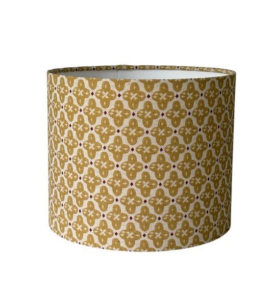 The handmade drum shade is 25cms diameter and 21cms high, is lined with white fire retardant PVC which meets UK Standards and has passed the Lighting Association Glow Wire Test. 