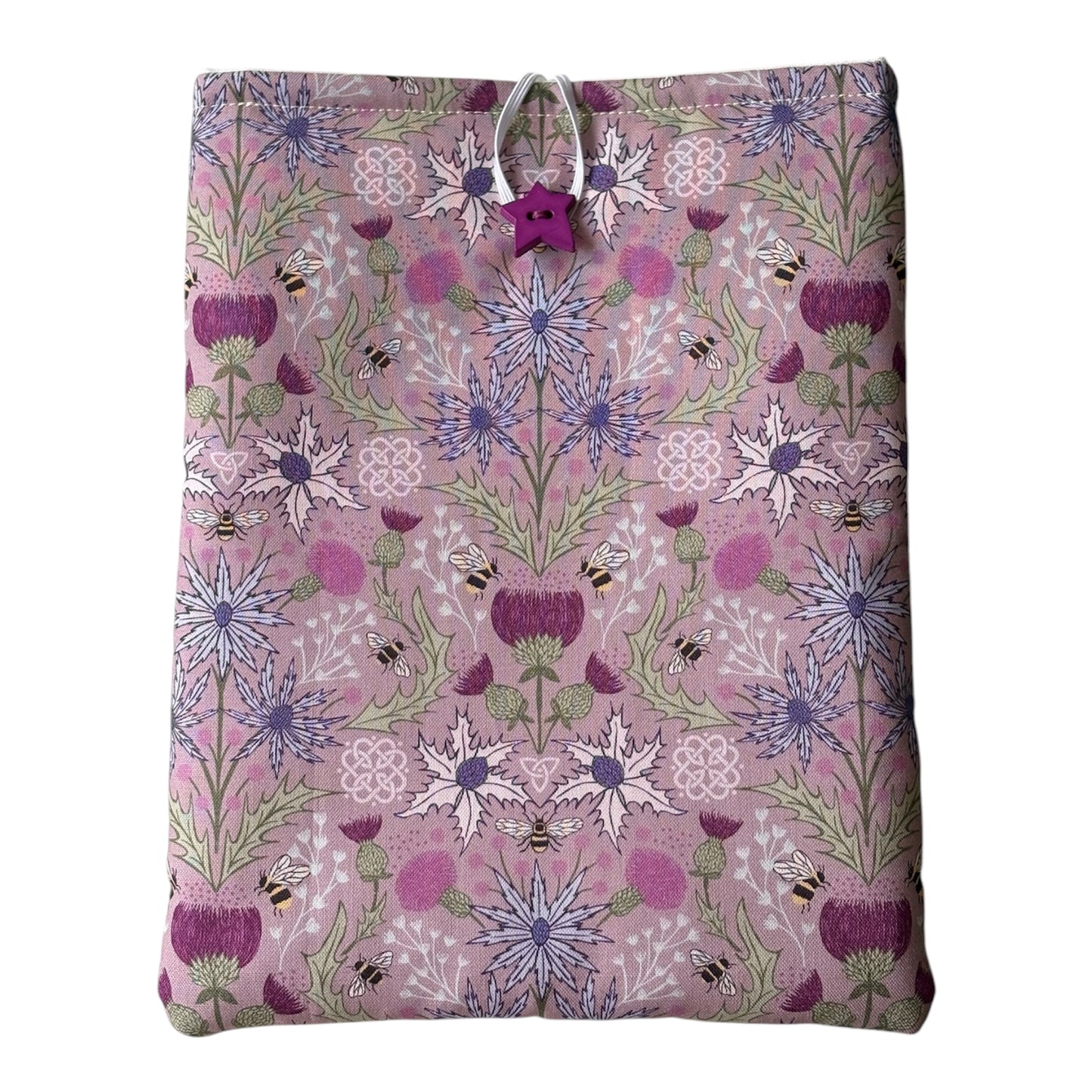 Handmade padded Book Pouch made with pretty Thistle and Bees patterned fabric in shades of purple and lilac.  The padded Book Cover would be an ideal Book Lovers Gift to protect books from wear and tear whilst being carried on the go. 