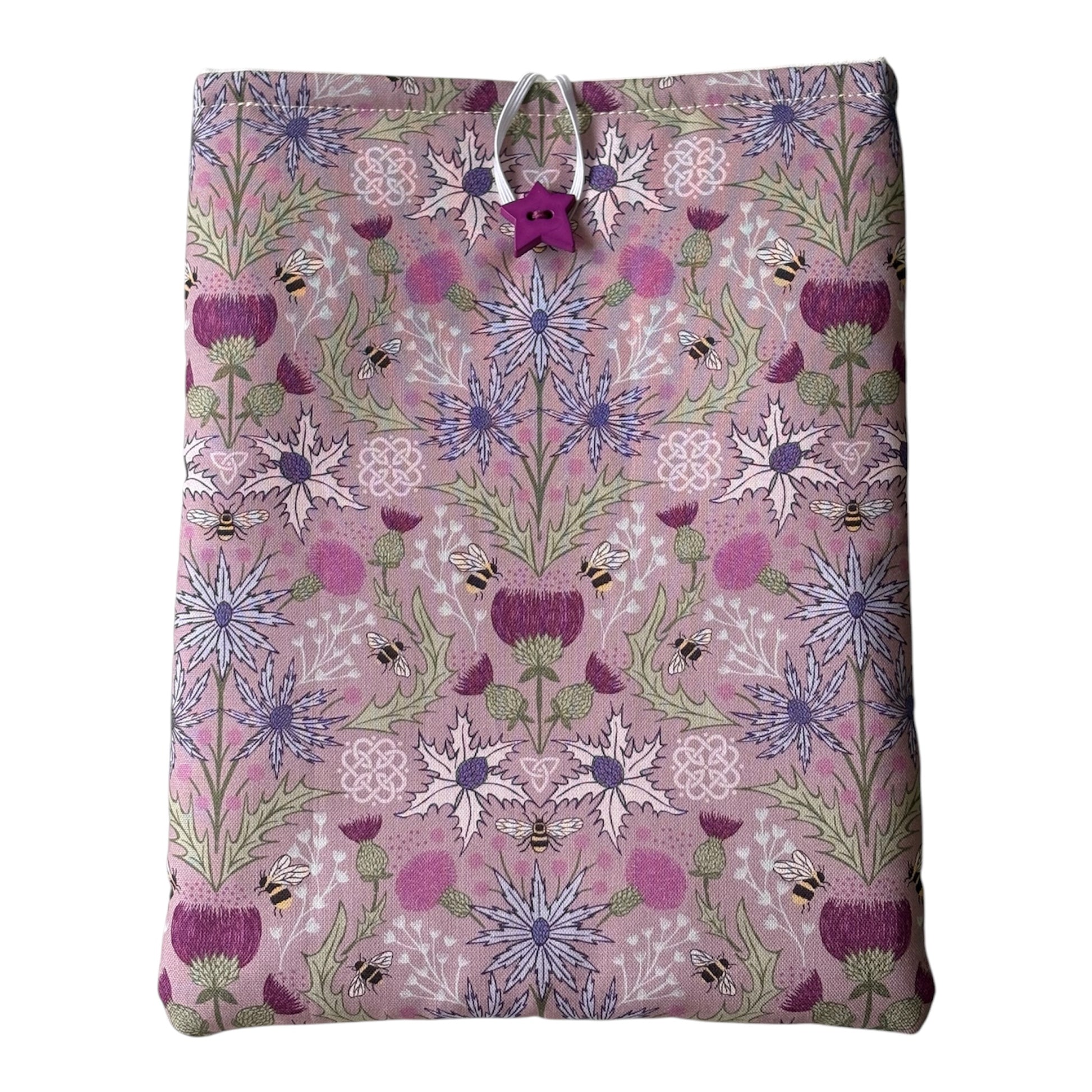 Handmade padded Book Pouch made with pretty Thistle and Bees patterned fabric in shades of purple and lilac.  The padded Book Cover would be an ideal Book Lovers Gift to protect books from wear and tear whilst being carried on the go. 