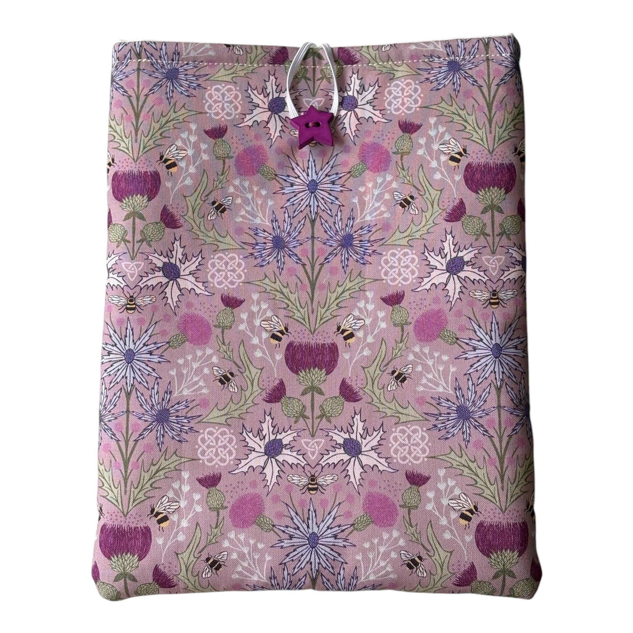 Handmade padded Book Pouch made with pretty Thistle and Bees patterned fabric in shades of purple and lilac.  The padded Book Cover would be an ideal Book Lovers Gift to protect books from wear and tear whilst being carried on the go. 