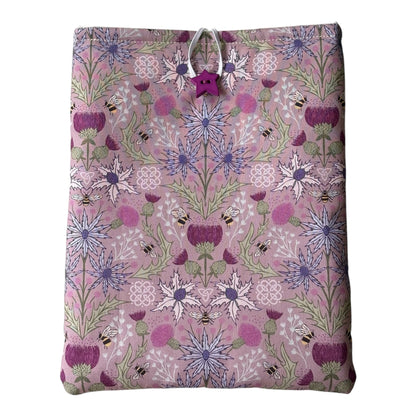 Handmade padded Book Pouch made with pretty Thistle and Bees patterned fabric in shades of purple and lilac.  The padded Book Cover would be an ideal Book Lovers Gift to protect books from wear and tear whilst being carried on the go. 