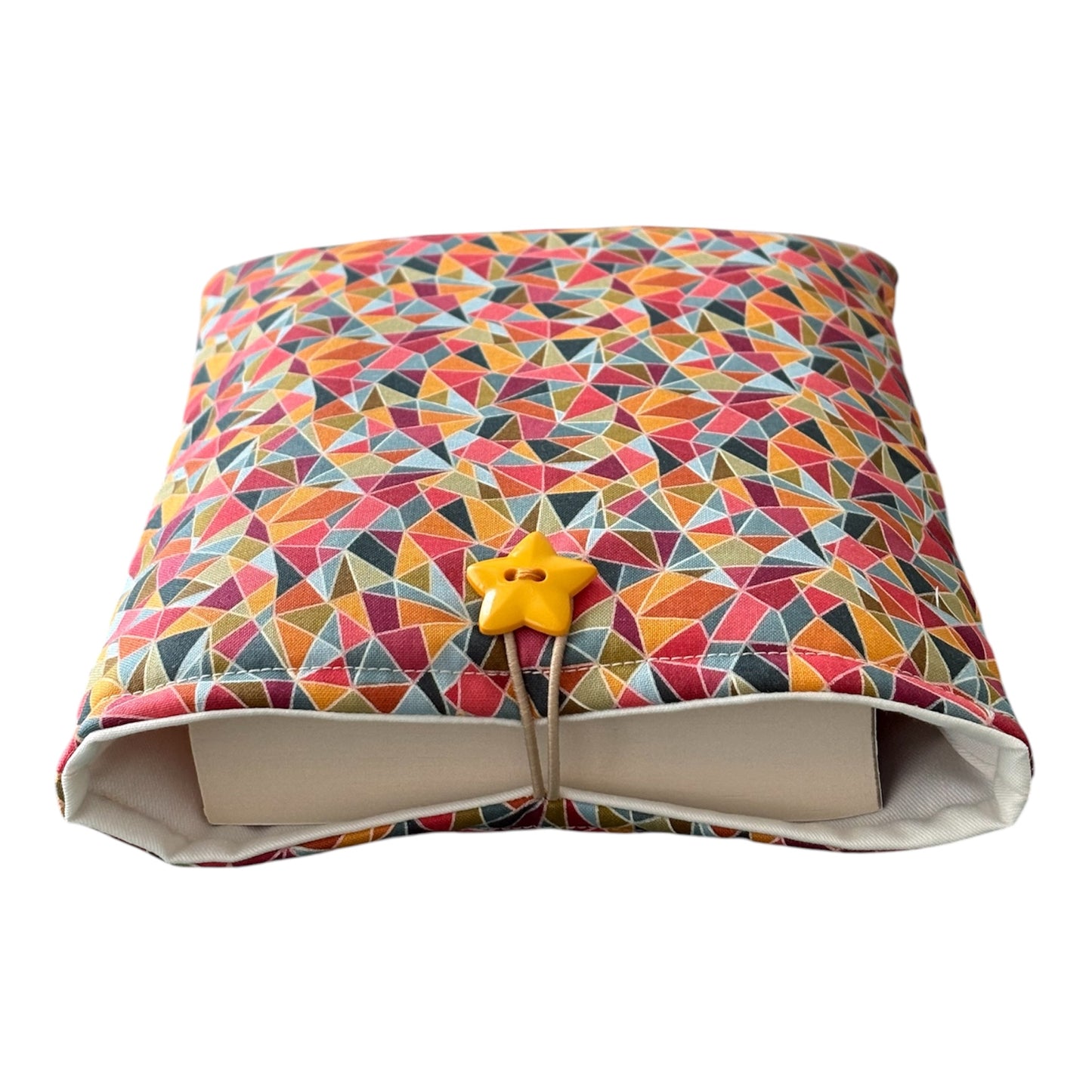 Please note the book in the photo is not included and is for illustrative purposes only.  The Book Pouch has been made using colourful abstract multicolour cotton fabric, is padded with polyester wadding and lined with neutral fabric.  The handmade Book Cover is finished with elastic and button fastening.