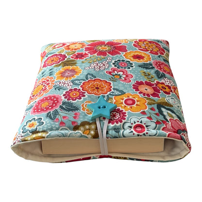 The padded Book Cover is approximately 18cms x 22.5cms (7inches  9inches) and may offer protection for a Kindle but check the measurement of the device prior to placing an order.  Please note the book in the photo is not included and is for illustrative purposes only.
