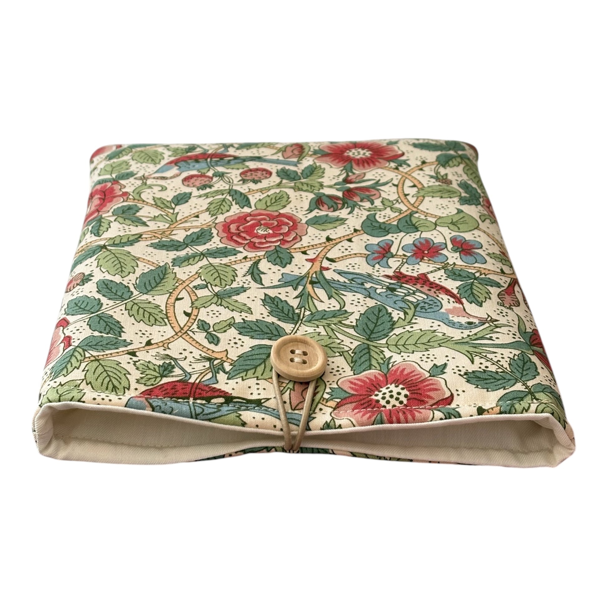The handmade padded Book pouch is lined with complementing neutral fabric, padded with polyester wadding and has elastic and button fastening.