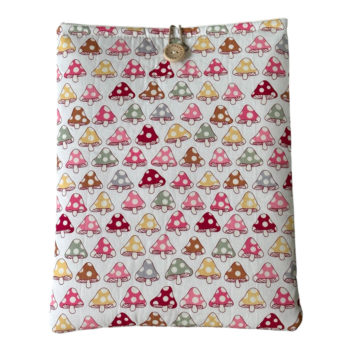 Handmade padded iPad Kindle Pouch made with cute toadstool patterned fabric in pastel colours.  The handmade  cover is approximately 27cms x 21.5cms but check the measurement of your electronic device prior to placing an order.