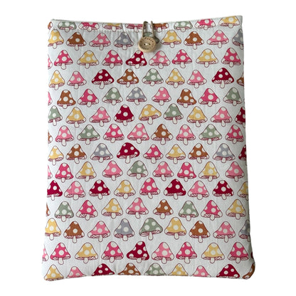 Handmade padded iPad Kindle Pouch made with cute toadstool patterned fabric in pastel colours.  The handmade  cover is approximately 27cms x 21.5cms but check the measurement of your electronic device prior to placing an order.