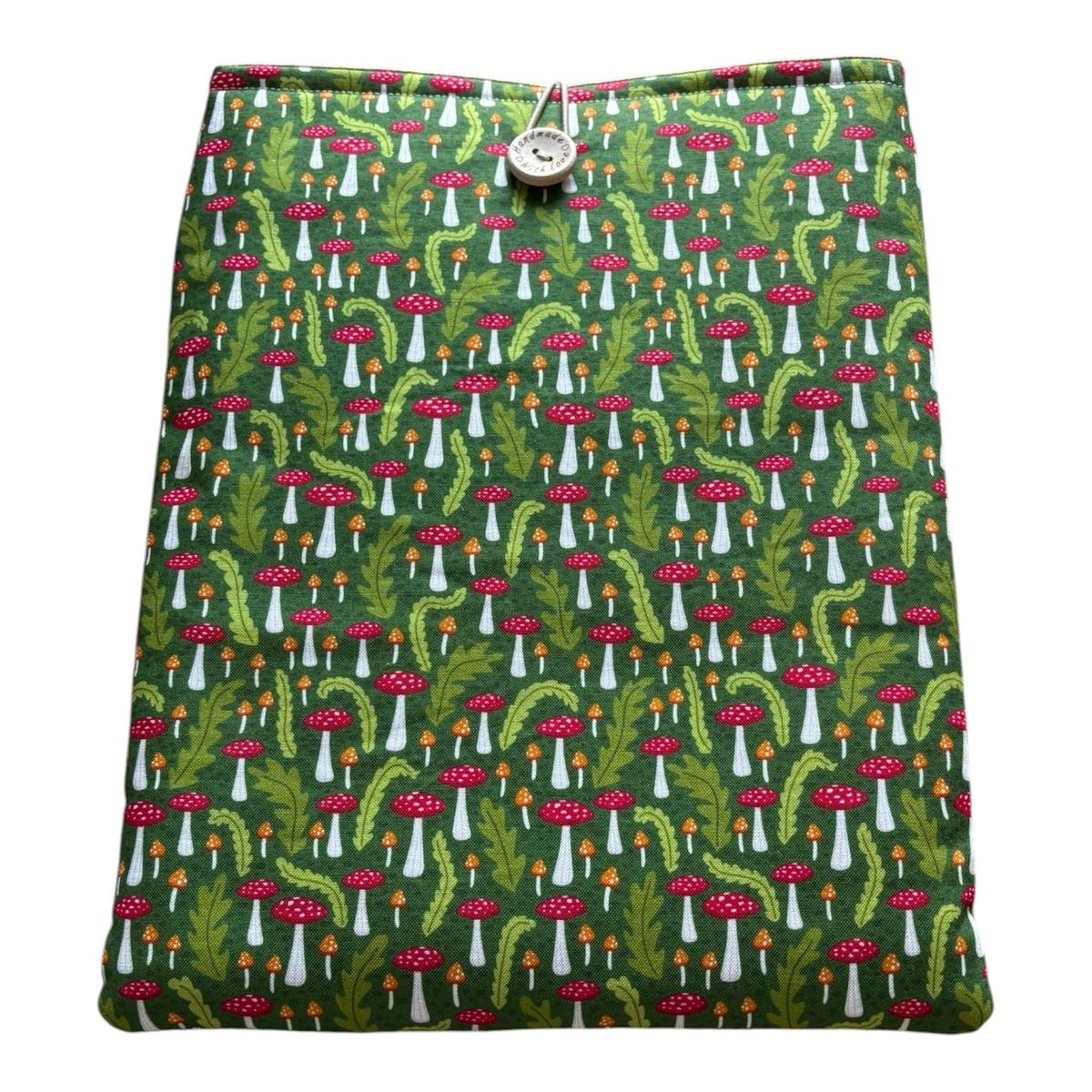 Handmade padded iPad Tablet Pouch made with fabric which has a toadstool and leaf pattern on a green background. 