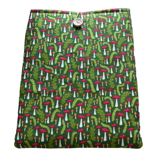 Handmade padded iPad Tablet Pouch made with fabric which has a toadstool and leaf pattern on a green background. 