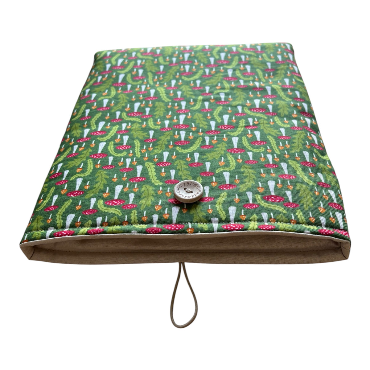 The padded pouch is lined with neutral plain fabric, padded with fusible fleece, polyester wadding and has elastic and button fastening. 