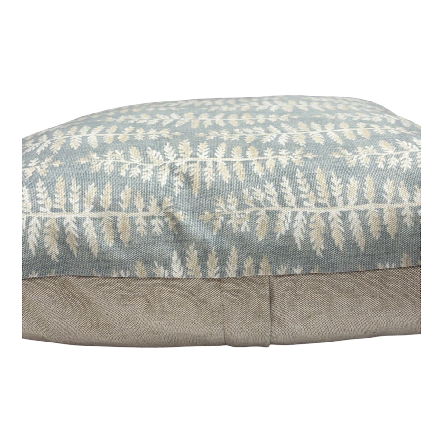 The cushion cover fastens with an enclosed zip in the rear of the cushion cover, as indicated.