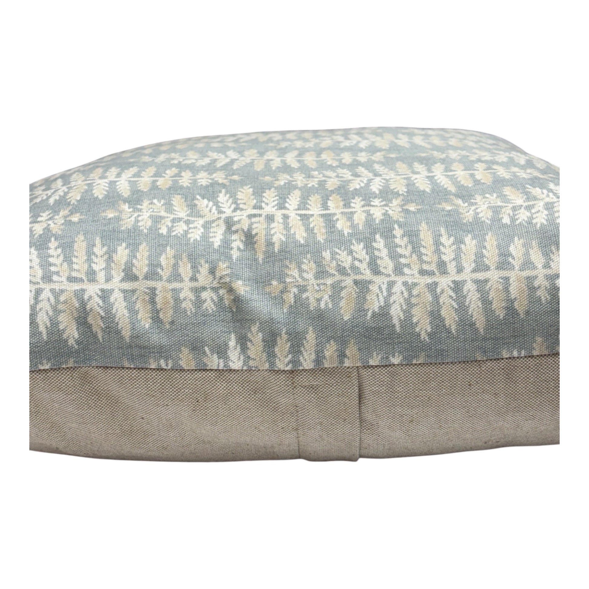 The cushion cover fastens with an enclosed zip in the rear of the cushion cover, as indicated.