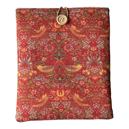 The padded Pouch has been made using William Morris Red Strawberry Thief cotton fabric, is padded with polyester wadding, lined with complementing neutral fabric and has button and elastic fastening.
