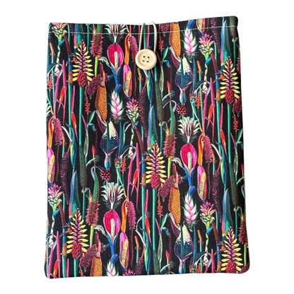 The Book Pouch fastens with elastic and button to keep a book or Kindle e-Reader safe.