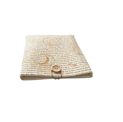 The padded Book Pouch is lined with neutral fabric and has elastic and button fastening.  The text on the fabric is a section of a book by Ernest Hemingway and is from Cat Tales range of fabrics.