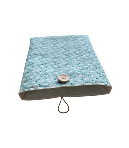 The daisy patterned fabric Book Pouch is lined with neutral fabric, padded with fusible wadding and has elastic and button closure.  